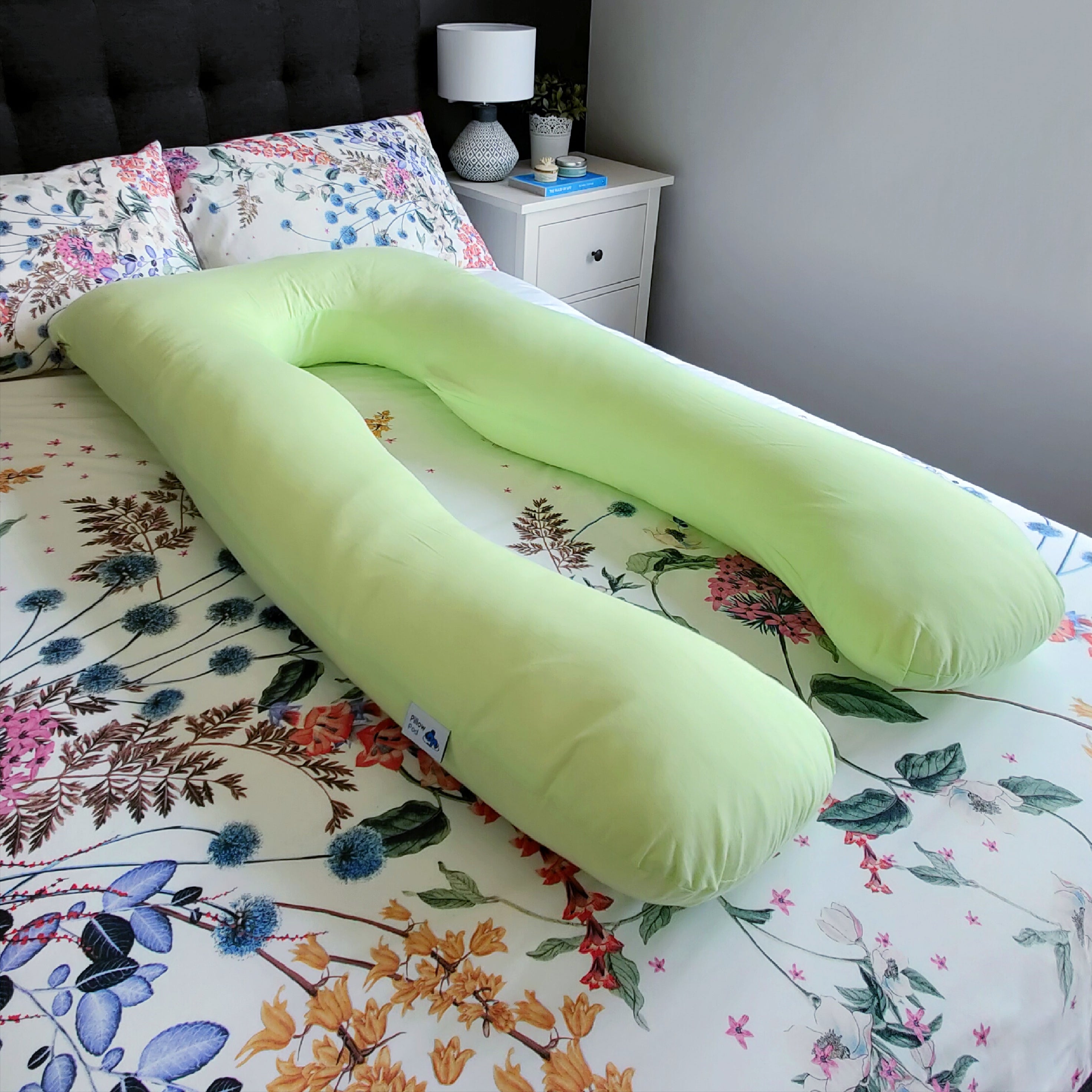 Mint Pillow Pod Full Body Support Pillow on Bed, with Flowery Bed Spread